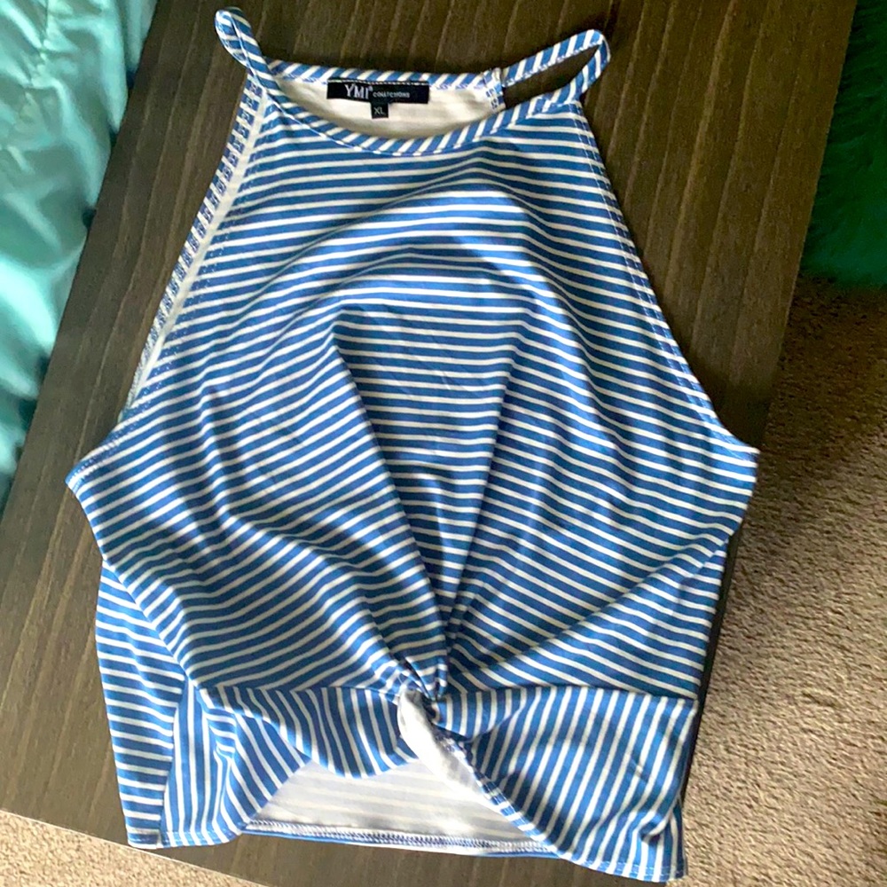 This shirt is a “YMI Collections”. It is 93% Polyester, 7% Spandex.